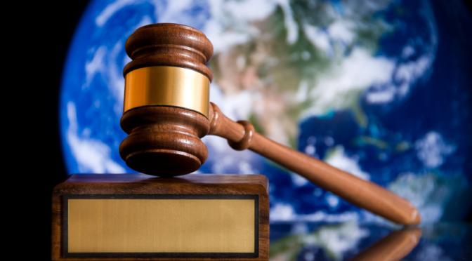 Wooden justice gavel and block with brass