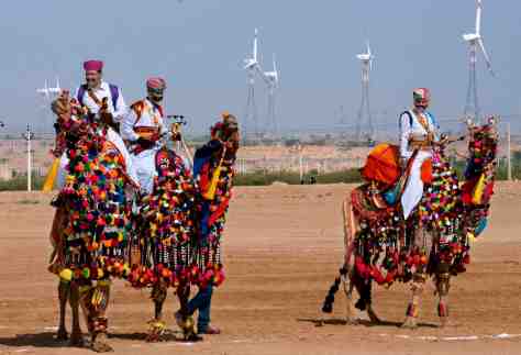 Camels and their riders in celebratory attire at the inauguration of a new wind farm in Khuri, Rajasthan, India. Sudipto Das